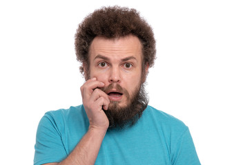 Portrait of scared bearded man with funny Curly Hair, looking at camera. Shocked caucasian man, isolated on white background.