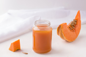 homemade pumpkin baby food. Mashed potatoes in a jar on a white background