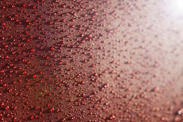 Droplets pattern on red backdrop. Juice splash. Red juicy surface drops, great design for any purposes. Texture background, pattern. Summer bright background. Bright sweet color.