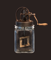 Vintage portable butter churn isolated on brown background.