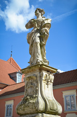 Fototapeta na wymiar Baroque statue of St. Catherine from 1756 in Lidzbark Warmiński, Warmian-Masurian Voivodeship, Poland.