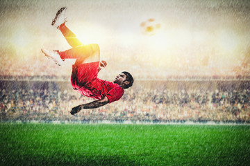 Fototapeta na wymiar Overhead kick by red player action in the stadium