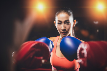 two asian women exercising together at the health club