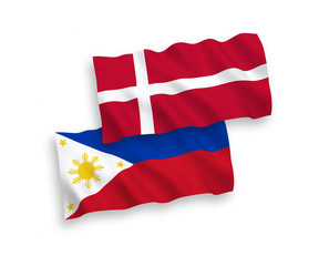 National vector fabric wave flags of Denmark and Philippines isolated on white background. 1 to 2 proportion.