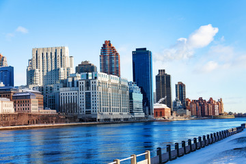 East river from Roosevelt Island in New York with Manhattan on background, NY, USA
