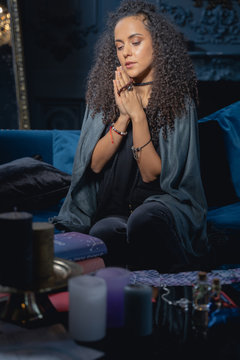 Serene female with clasped hands chanting mantras