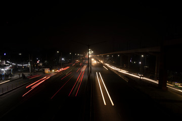 Fototapeta na wymiar Speed Traffic light trails on highway, long exposure, urban background and dark sky