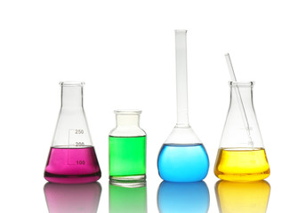 Different laboratory glassware with colorful liquids isolated on white