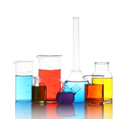 Different laboratory glassware with colorful liquids isolated on white