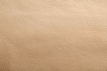 Texture of beige leather as background, closeup