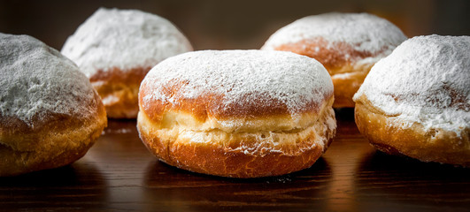 Homemade donuts on dark brown backgrand