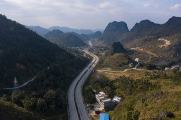 A curved highway between rural valleys