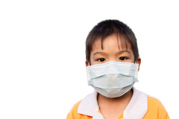 Selective​ focus.​ Asian child boy wearing a protection mask​ for​ prevent​ Corona​ virus​ or​ dust PM 2.5 air pollution. On a white background. Environmental and healthy concept.