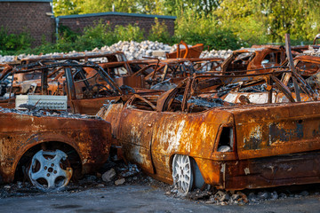 rusted burnt out car wrecks