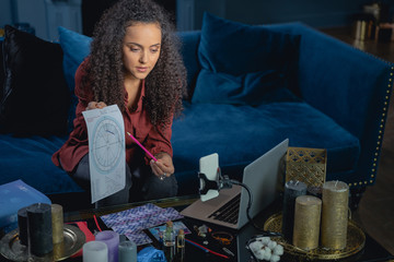 Young woman explaining the basics of astrology