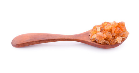 Fototapeta na wymiar Gravel sugars in a wooden spoon isolated on a white background