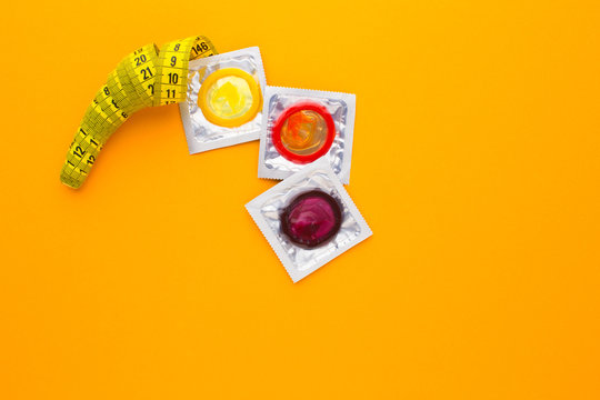color condom in isolated on a yellow background