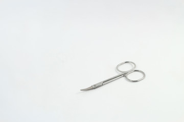 Silver scissors and white background