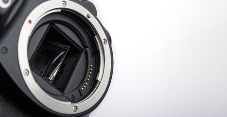 Closeup DSLR camera without lens, ready for sensor cleaning. Place for text