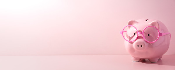 Pink piggy Bank on a pink background