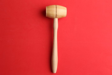 small wooden mallet made of pine wood