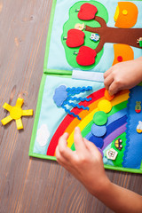 Naklejka premium Teaching preschoolers through fun games with a quiet book