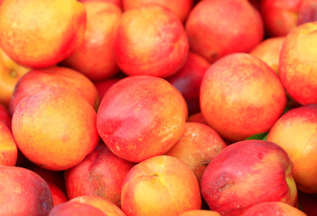 Fototapeta na wymiar Many ripe peaches are together