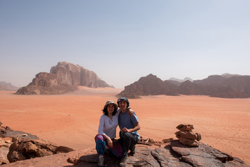 Couple making a photo in Wadi Rum desert, Jordan