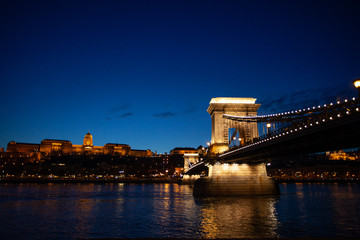 Hungarian Chain bridge, Royal palace and Danube river in Budapest at night