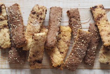 Homemade shortbread puff pastry chocolate chip cookies on a wooden white table.