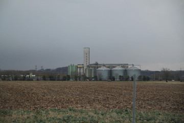 Fototapeta na wymiar Agribusiness silo tank storage storm