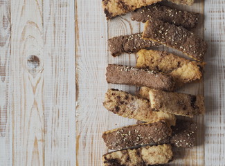 Homemade shortbread puff pastry chocolate chip cookies on a wooden white table.