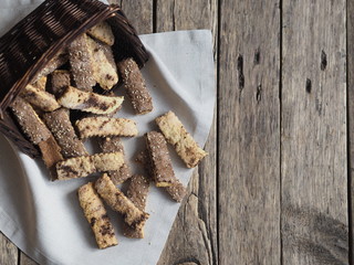 Homemade shortbread puff pastry chocolate chip cookies on a wooden white table.