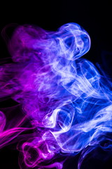 Fototapeta premium Colored smoke on black background
