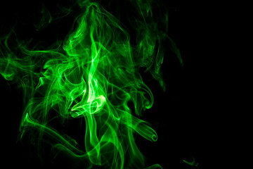 Green smoke on black background