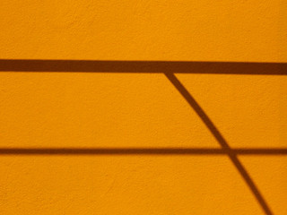 shadow on yellow wall texture
