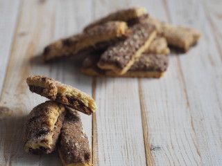 Homemade shortbread puff pastry chocolate chip cookies on a white wooden table.