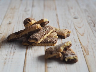 Homemade shortbread puff pastry chocolate chip cookies on a white wooden table.