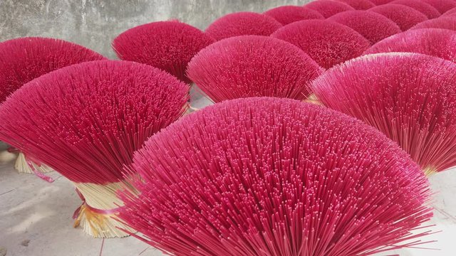 Colorful traditional vietnamese incense or joss sticks displayed in a beautiful floral pattern at a incense factory near Hanoi, Vietnam..