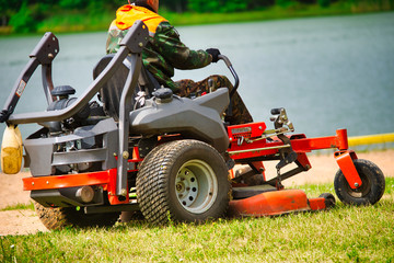 mowing grass on a lawn mower of large areas