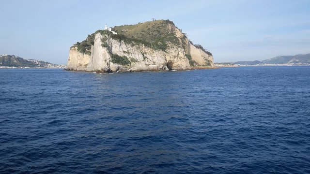 Campi Flegrei, Naples, Campania, Italy: the lighthouse of Cape Miseno seen from the sea. Capo Miseno is the headland on the Bay of Pozzuoli and the Gulf of Naples