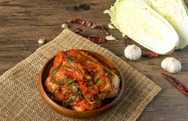 Traditional Korean Kimchi in a bowl on wooden background, top view, Korean food ,Korean food traditional cuisine. Fermented food. Vegetarian food good for health, Vegan for weight control diet