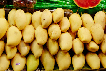 Mango and pineapple at fruit market 