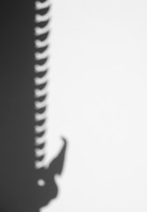 abstract black shadow of Thai pattern art on white wall in temple