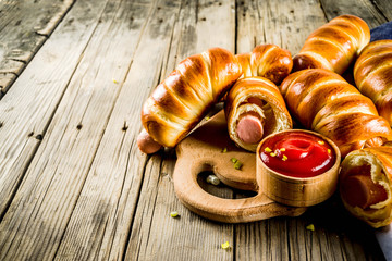 Pretzel wrapped hot dogs with sausages