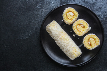 coconut sponge cake roll biscuit (delicious sweet dessert) menu concept. background. top view. copy space
