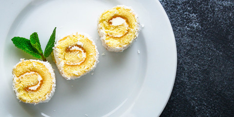 coconut sponge cake roll biscuit (delicious sweet dessert) menu concept. background. top view. copy space