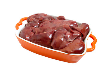 Raw chicken liver in a bowl isolated on a white background. Offal. Ready to cook.  Dishes from the liver.