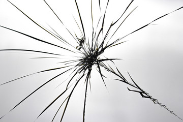 Cracks on broken glass. Abstraction pattern on the window.