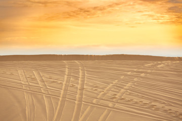 Naklejka premium Sand Dunes full off vehicle tracks leaving three distinct paths forward. Choose your path, Follow your path or The right path Concepts. Mui Ne,Vietnam